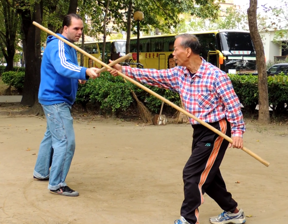 Master Lin Miao Hua and Franklin Fick practicing Taiji Quan 2 person staff work